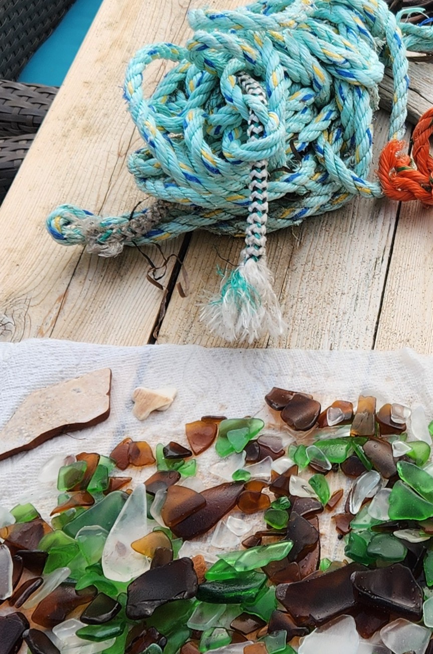 Sea glass and materials arranged on a work table